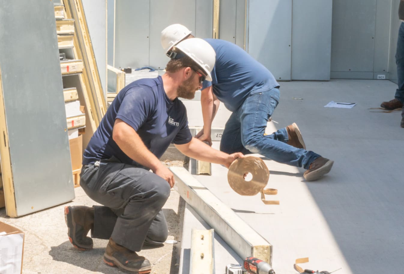 Image of workers performing an installation