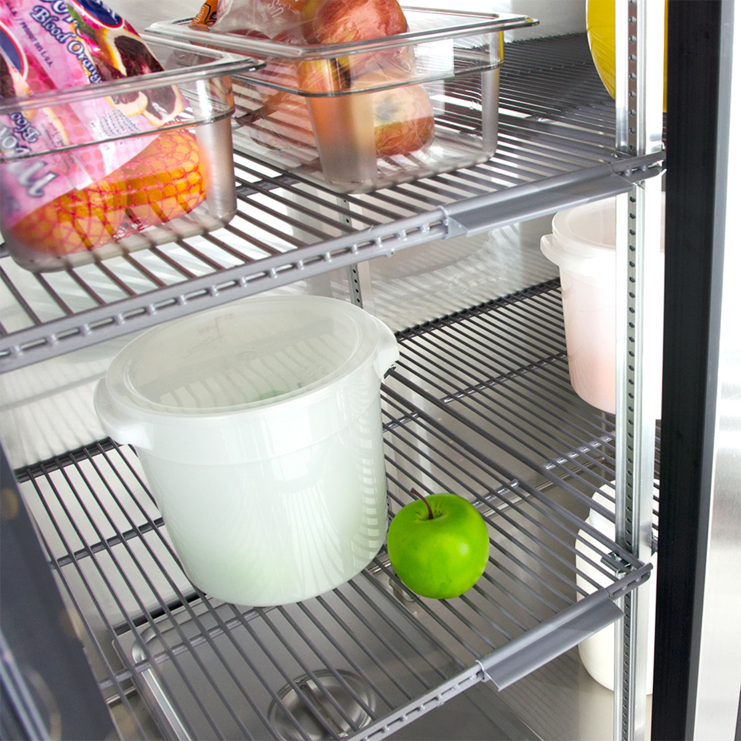 Close-up of adjustable wire shelving inside True glass door reach-in refrigerator
