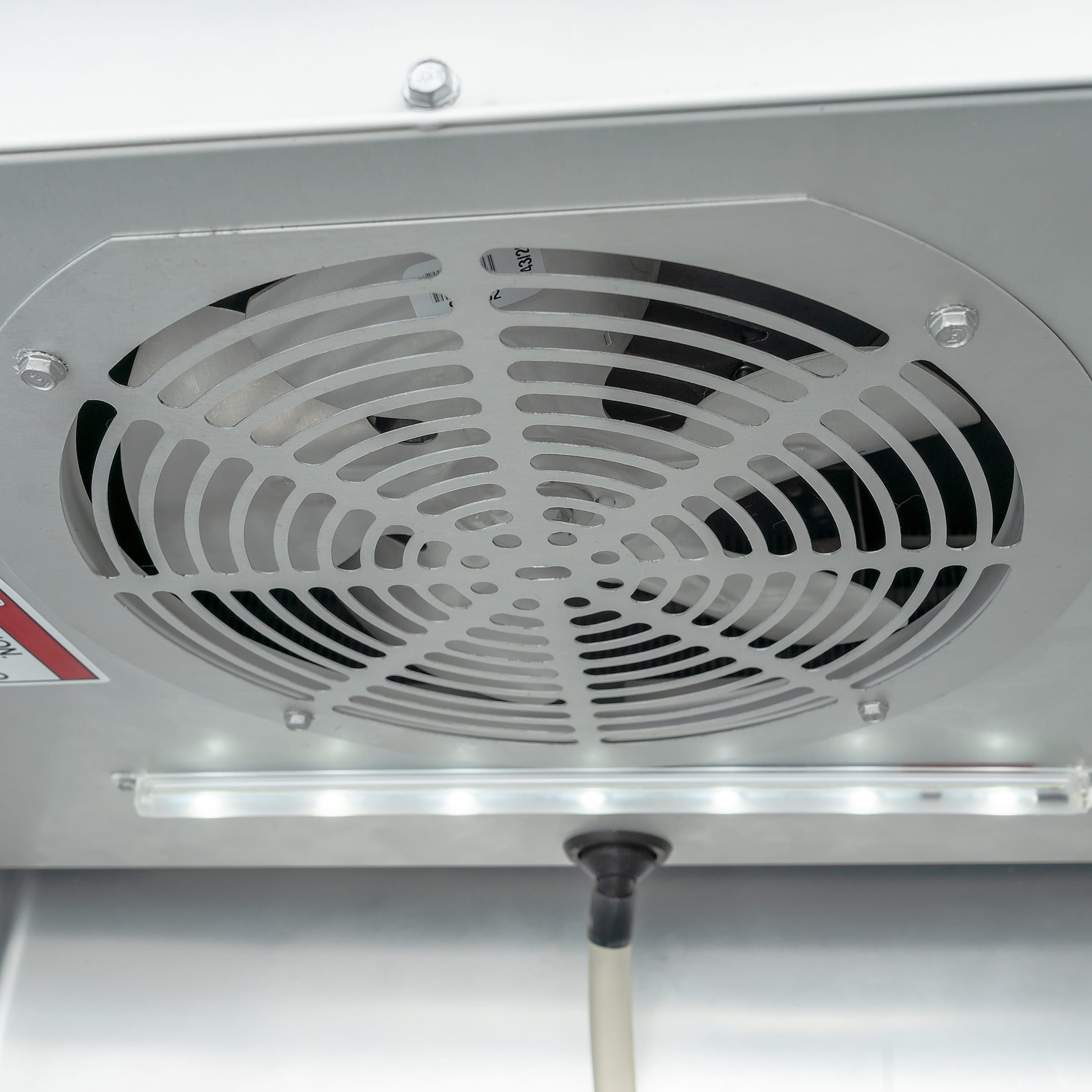 Ceiling-mounted evaporator fan and interior light inside True T-12-HC refrigerator