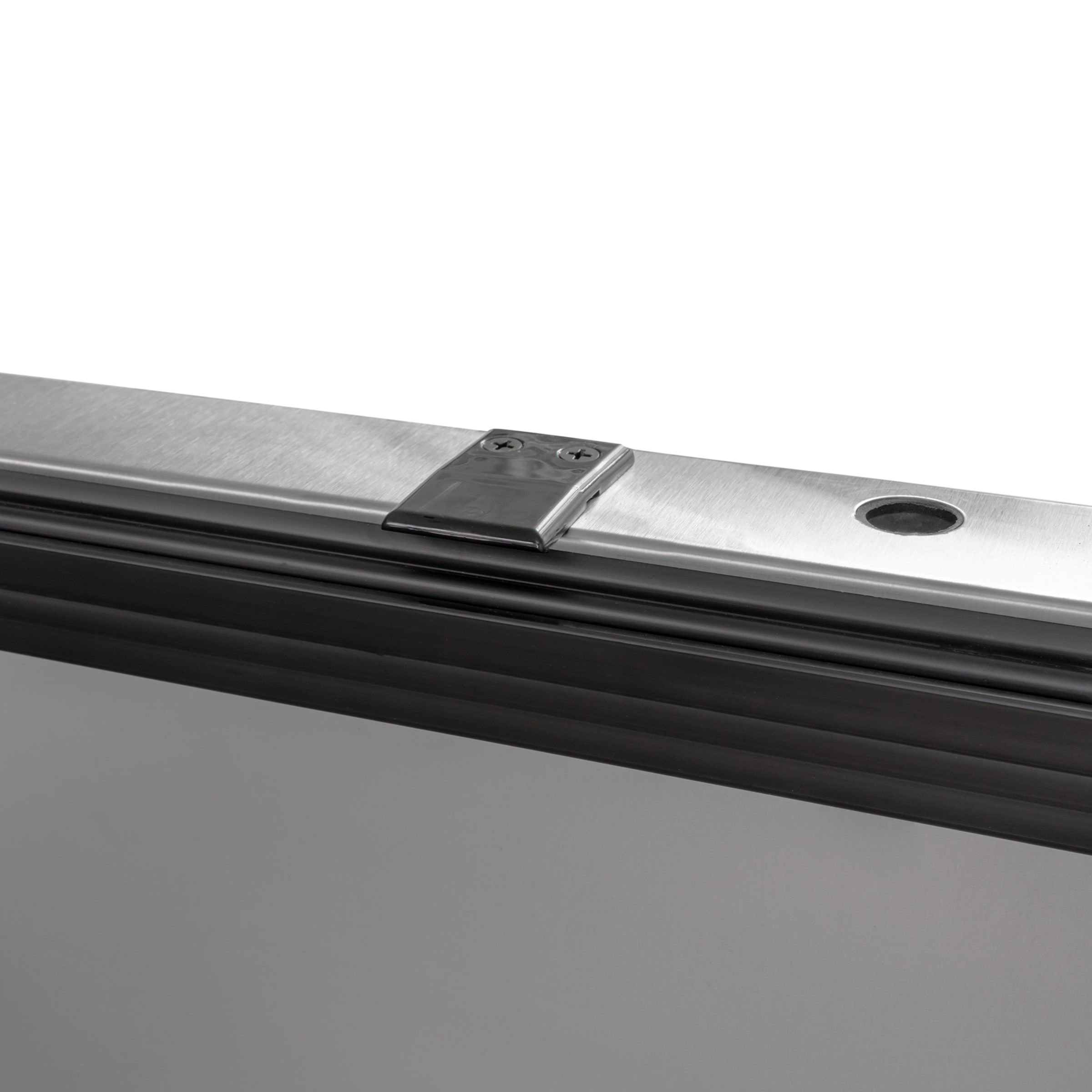 Close-up of True refrigerator door hinge and gasket area